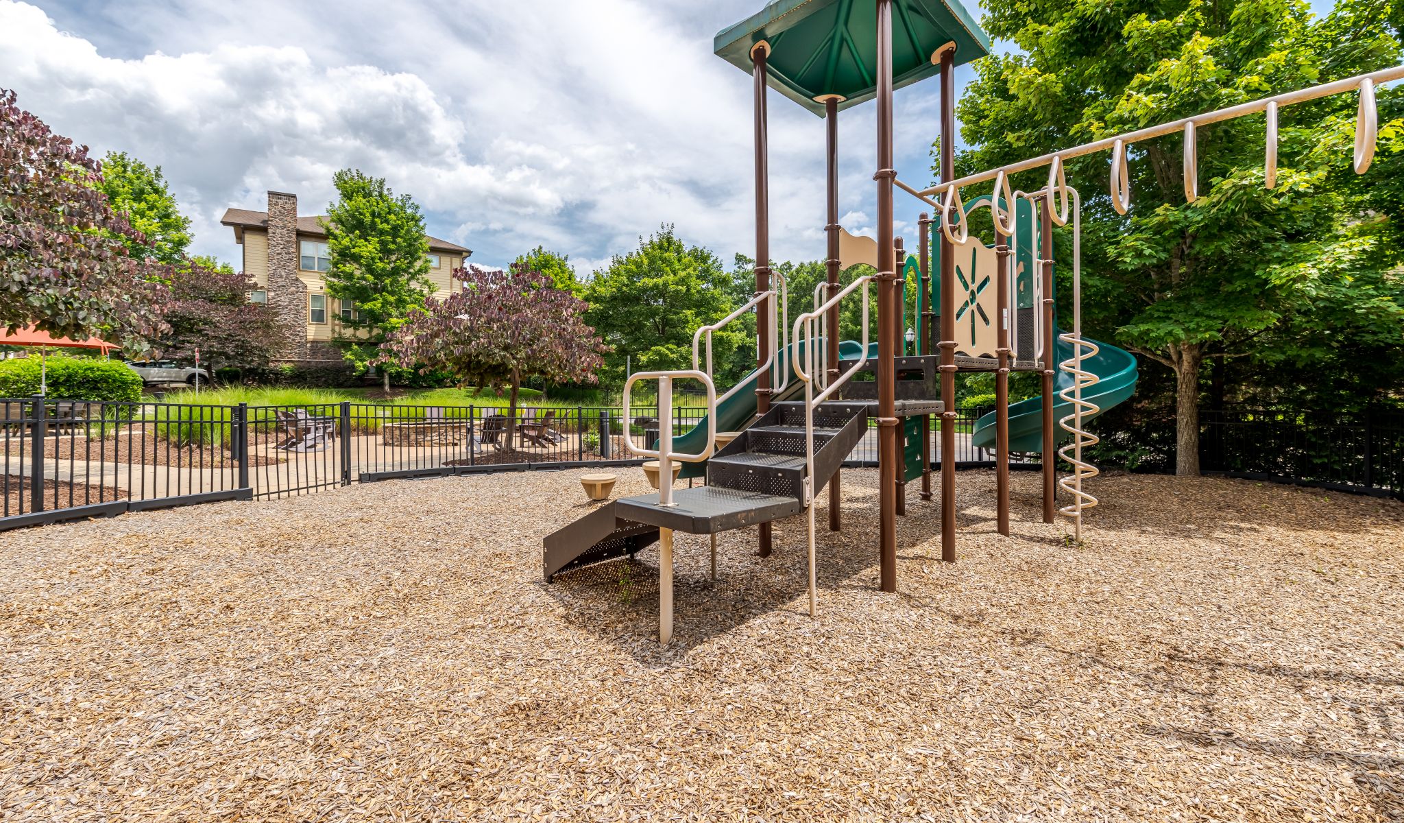 Cosgrove Hill at Chapel Hiil, NC. A playground featuring a slide and a basketball hoop.