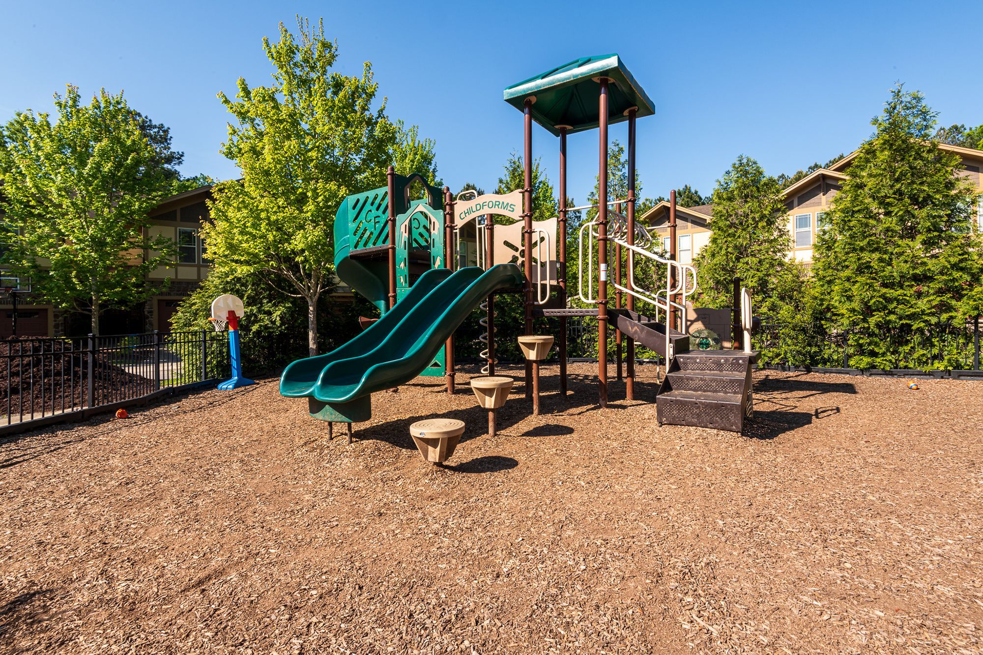 Cosgrove Hill at Chapel Hiil, NC. A playground featuring a slide and a basketball hoop.