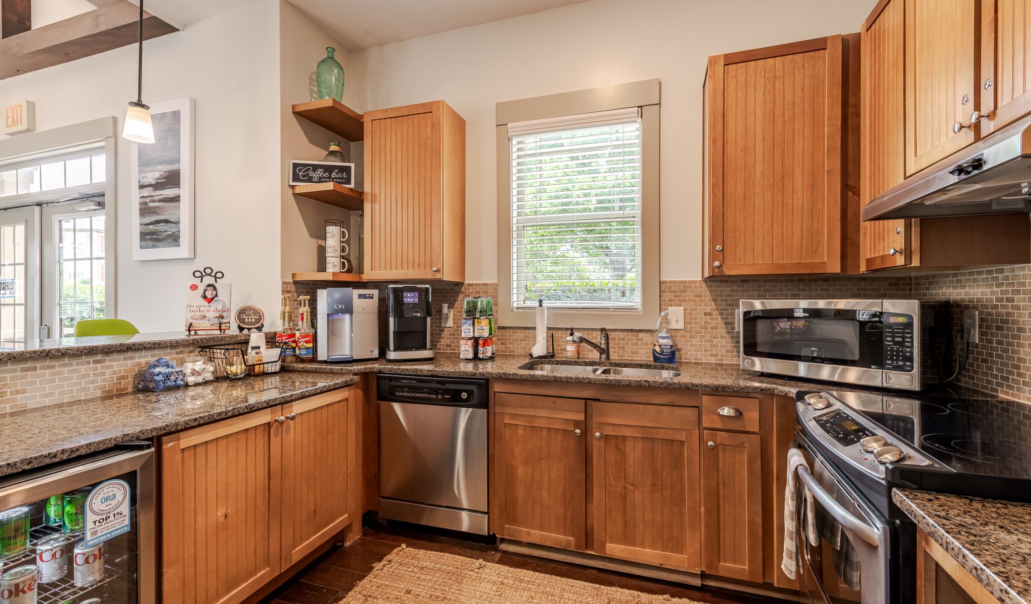 Cosgrove Hill at Chapel Hiil, NC. A contemporary kitchen featuring stainless steel appliances and wooden cabinets.
