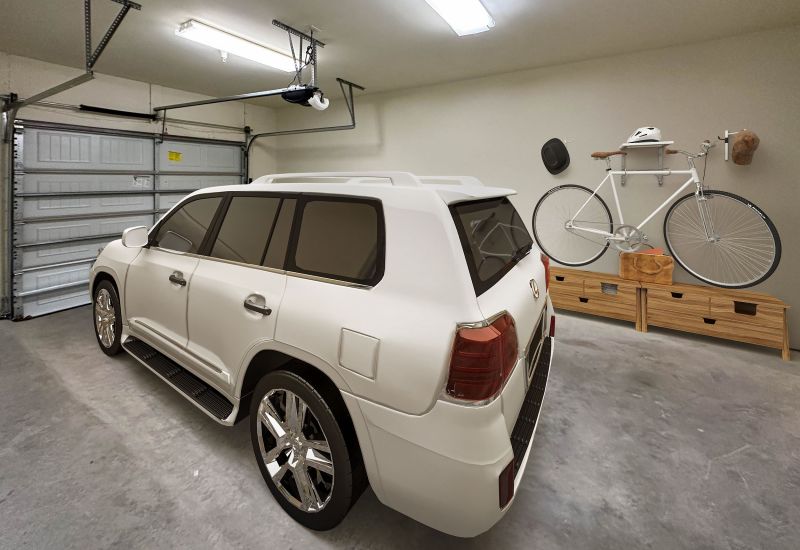 Cosgrove Hill at Chapel Hiil, NC. Garage with white SUV parked and bike hanging on wall.