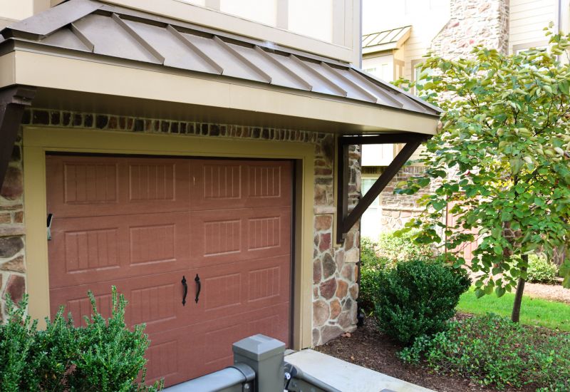 Cosgrove Hill at Chapel Hiil, NC. Garage with white SUV parked and bike hanging on wall.