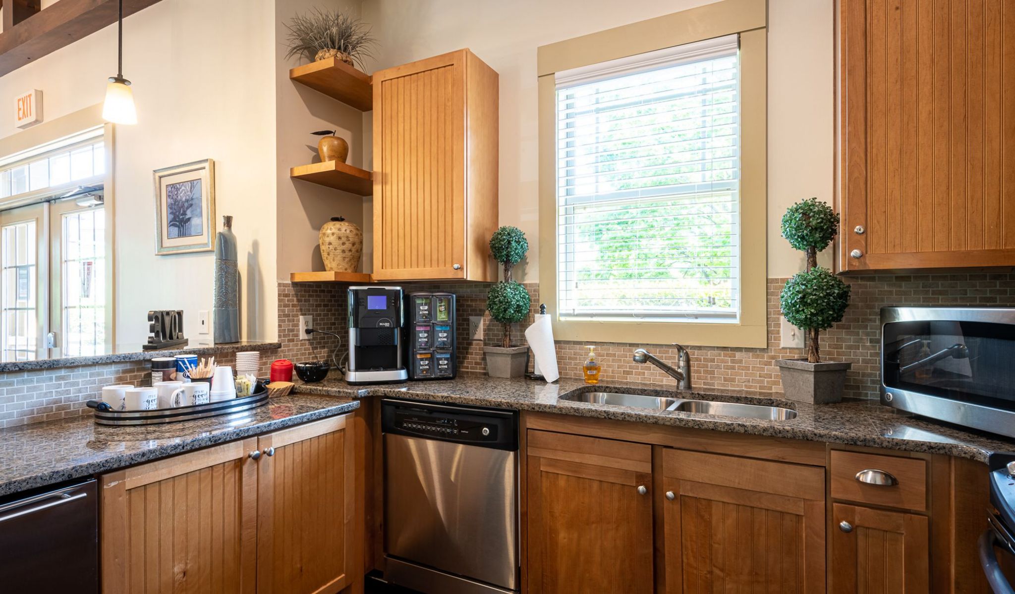 Cosgrove Hill at Chapel Hiil, NC. A contemporary kitchen featuring stainless steel appliances and wooden cabinets.