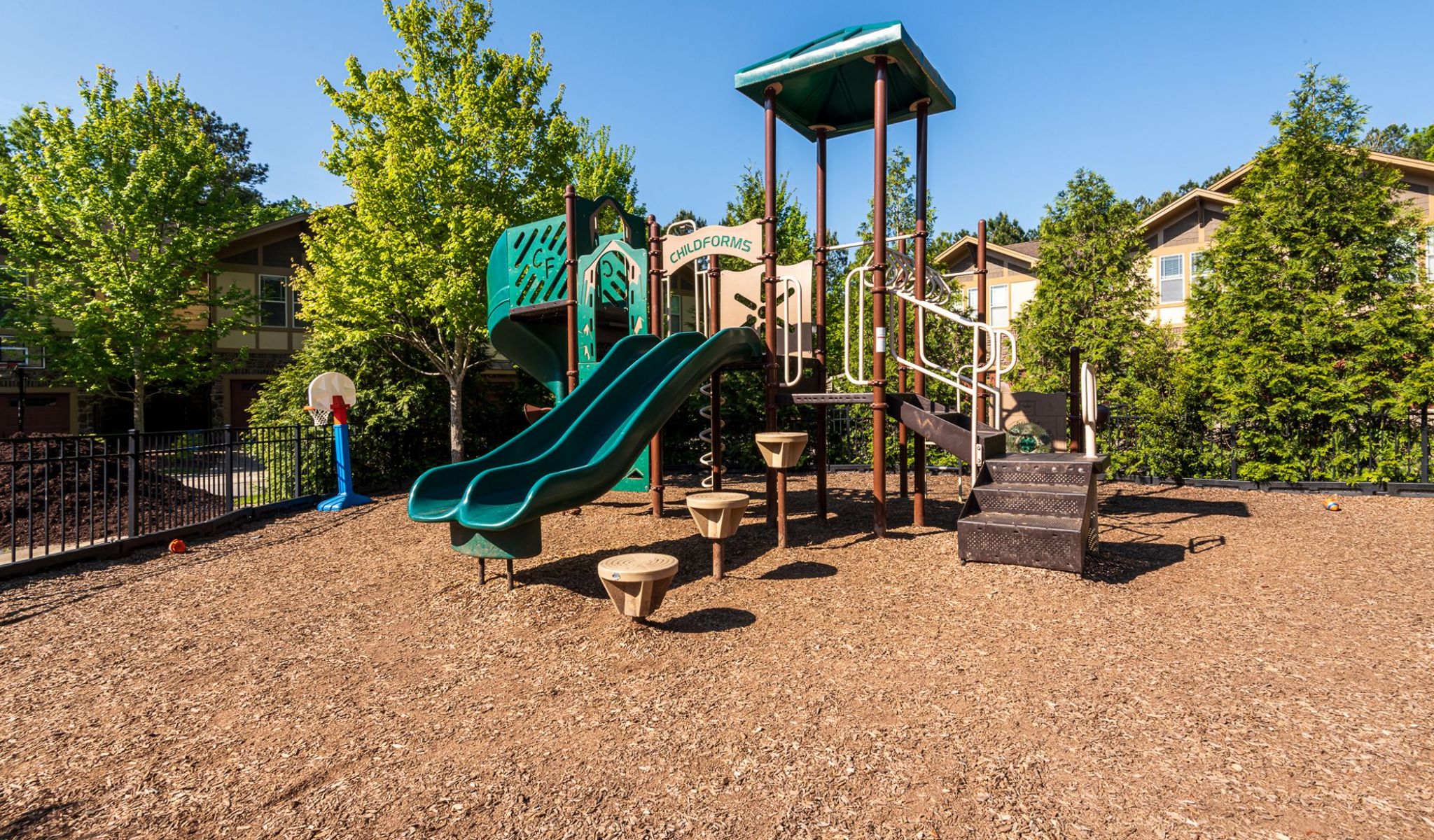 Cosgrove Hill at Chapel Hiil, NC. A playground featuring a slide and a basketball hoop.