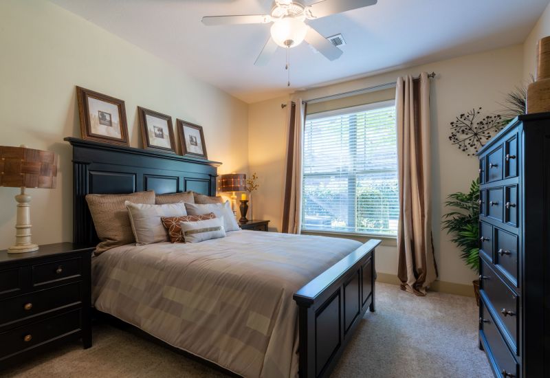 Cosgrove Hill at Chapel Hiil, NC. Bedroom interior featuring a bed, dresser, and nightstands.