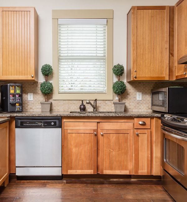 Cosgrove Hill beautiful luxury townhome kitchen with island, stainless steel appliances, wine storage, and more